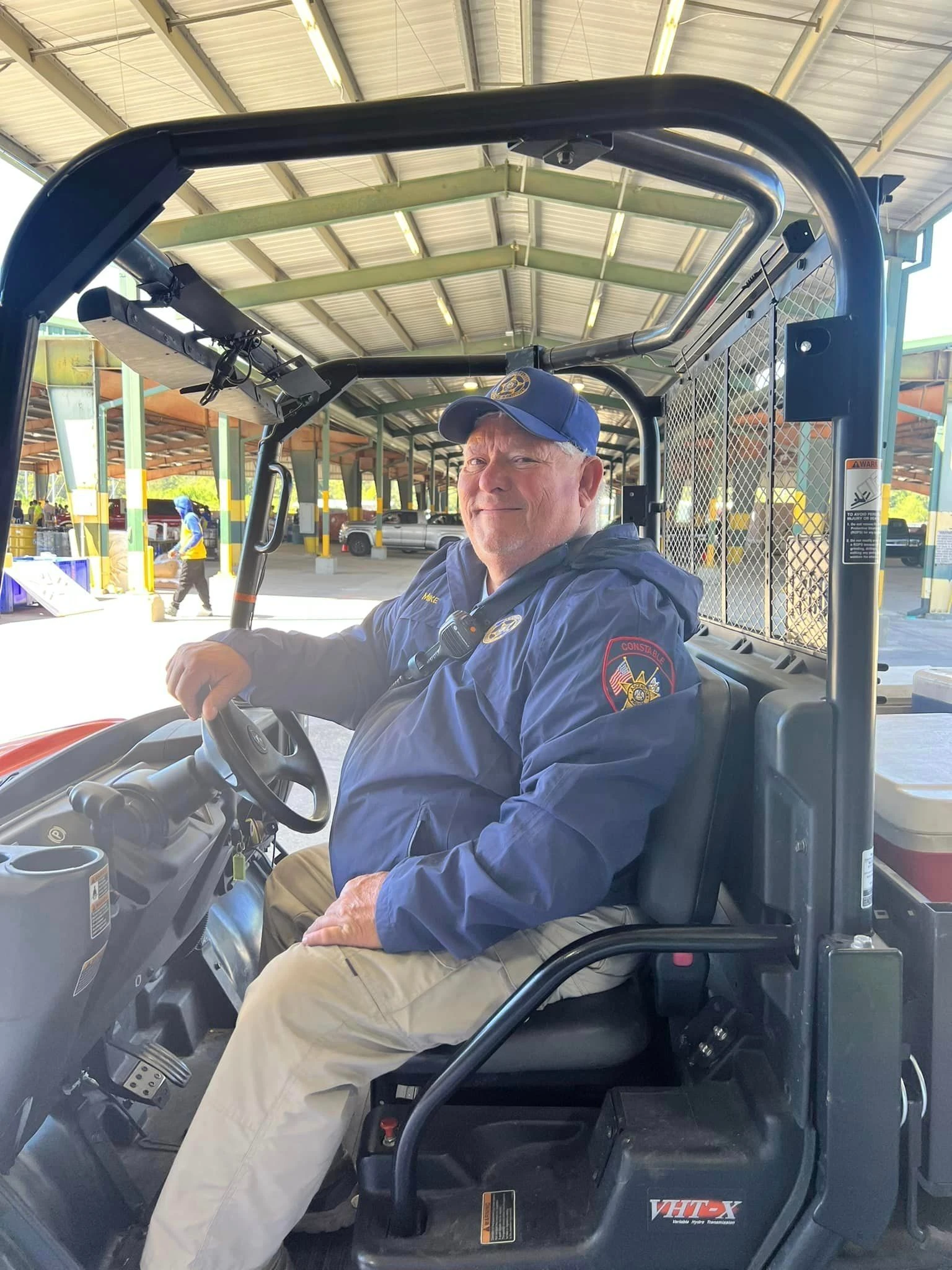 Volunteer in golf cart